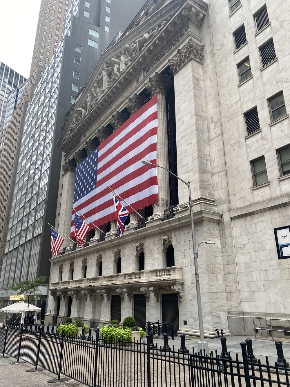 The New York Stock Exchange draped in a large American flag