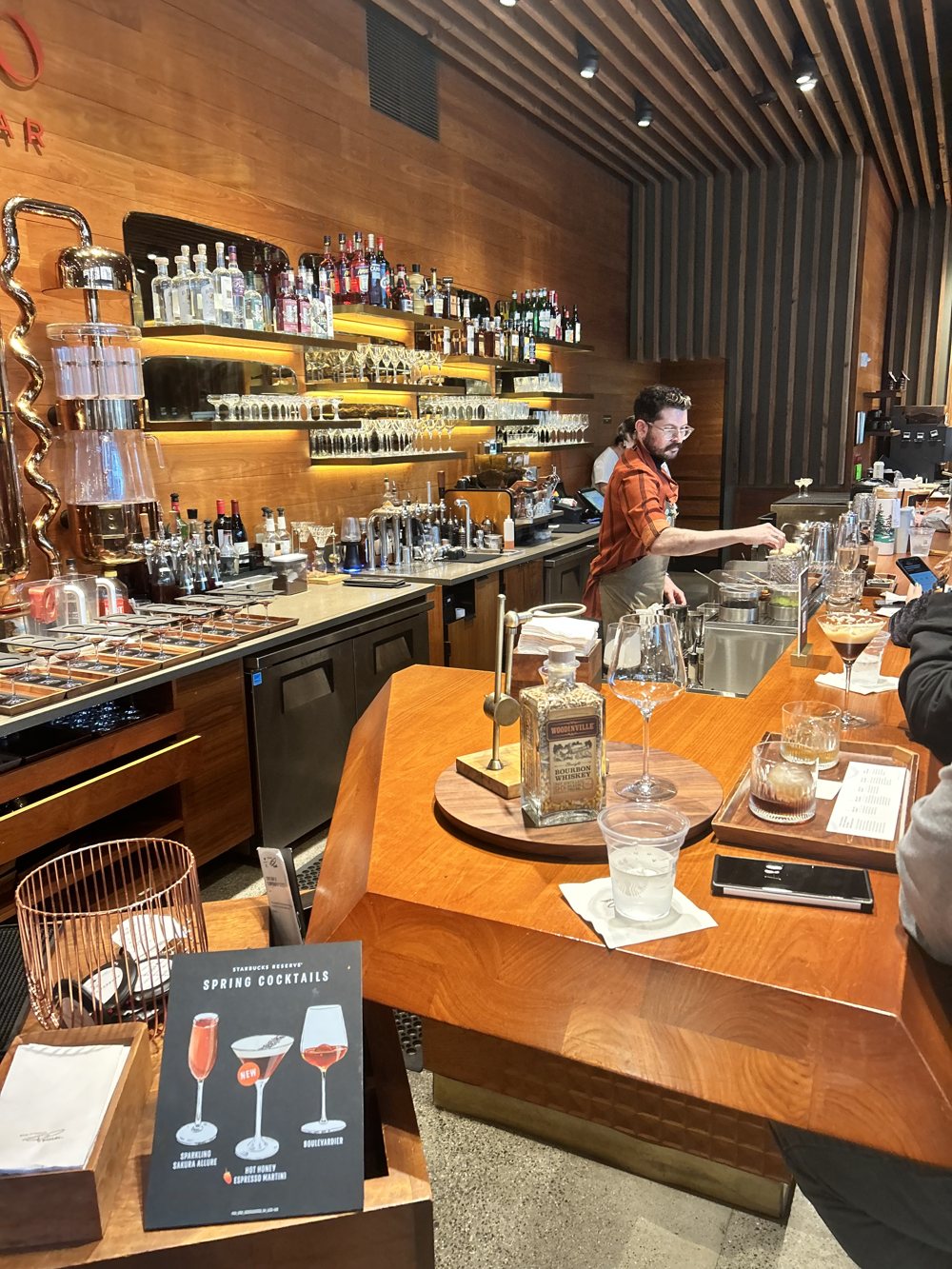 Cocktails at a warm wood-panelled bar