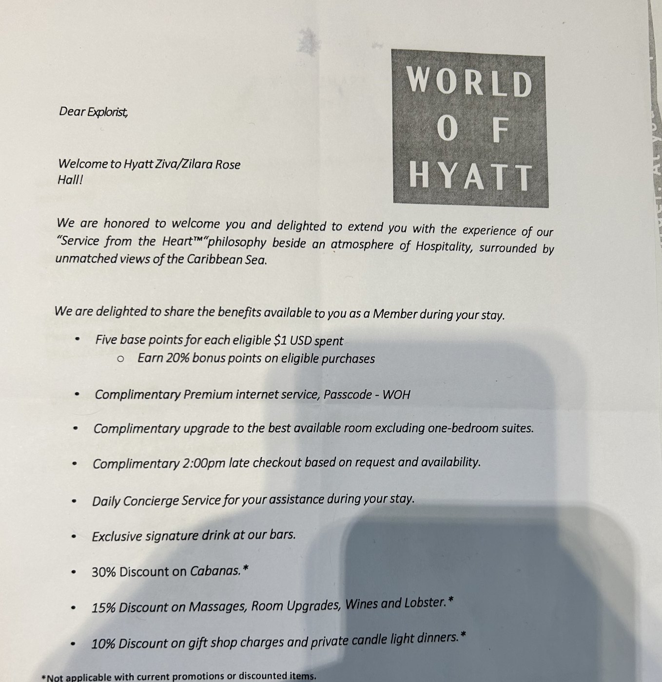 Photographed World of Hyatt welcome letter addressed to an Explorist member at Hyatt Ziva/Zilara Rose Hall, listing member benefits for the stay